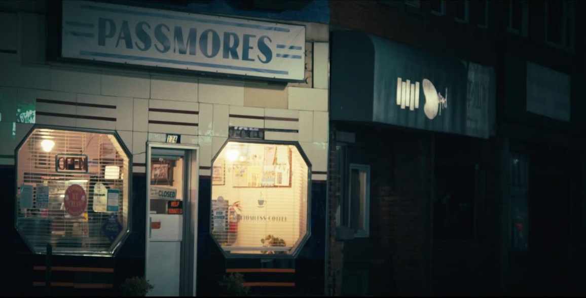 Still from White Knuckle: Passmores diner glowing at night, its octagonal windows lit warm